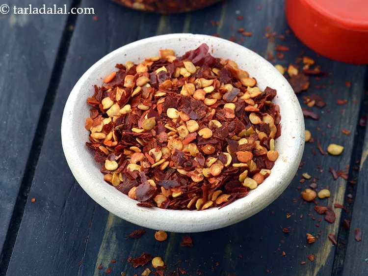 Step 12 – Add 1 tsp&nbsp;<a href="https://www.tarladalal.com/glossary-dry-red-chilli-flakes-paprika-338i">dry red chilli flakes (paprika)</a>.