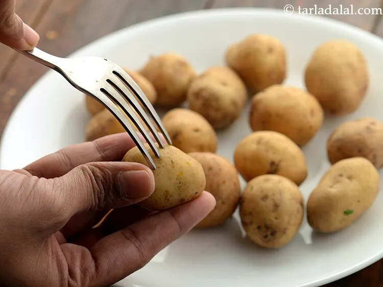 Step 14 – Pierce each potato all around with a fork and heat oil in a deep non-stick …