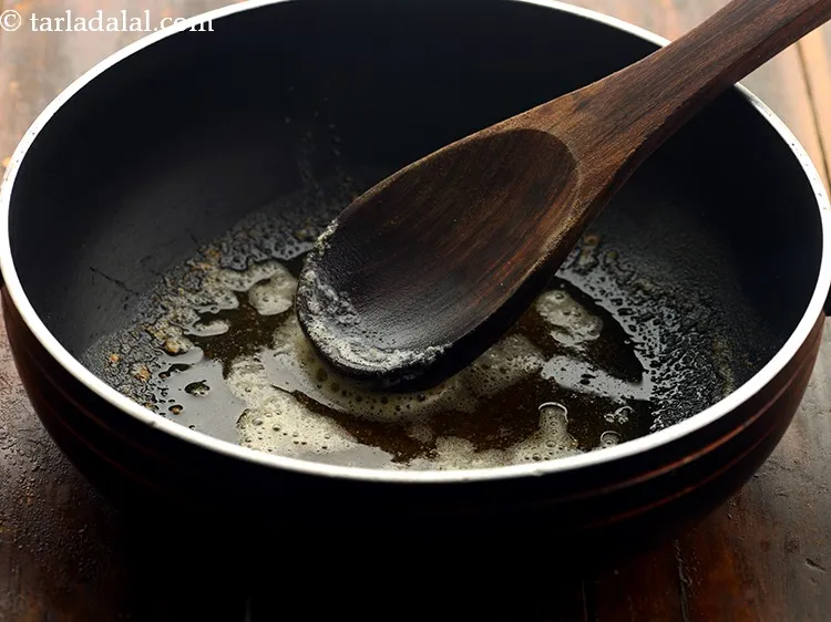 Step 18 – To prepare <strong>Banarasi dum aloo</strong>, add the butter and oil &nbsp;in a deep non-stick pan.&nbsp;