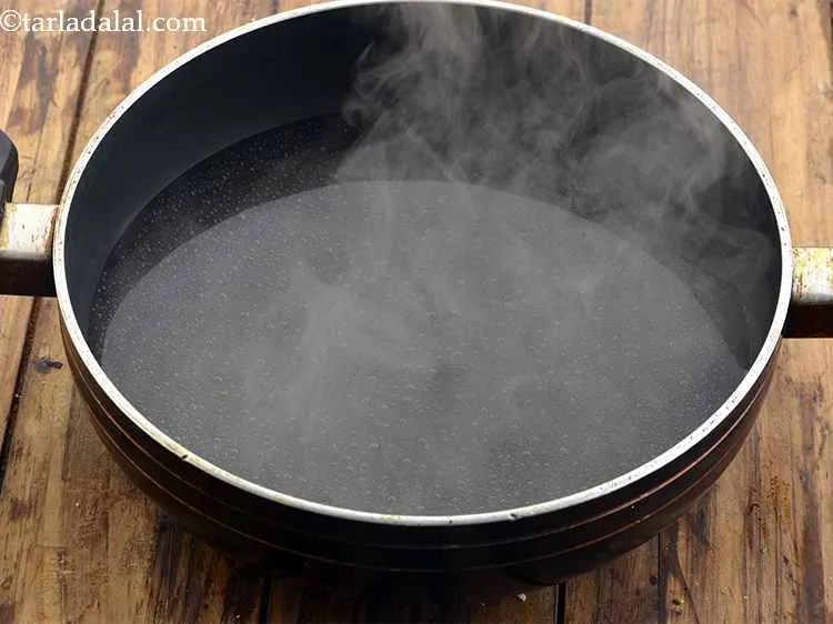 Step 11 – Take kadhai and fill it up with 3 cups of water.