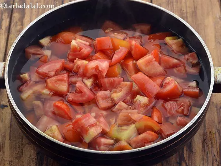 Step 12 – Add the tomatoes and mix well.