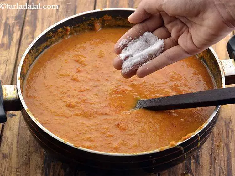 Step 34 – Now add the salt to taste to the <strong>Dum Aloo</strong> gravy.