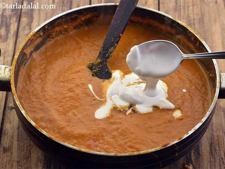 Step 38 – Add the fresh cream for a rich mouthfeel to the Dum Aloo gravy.