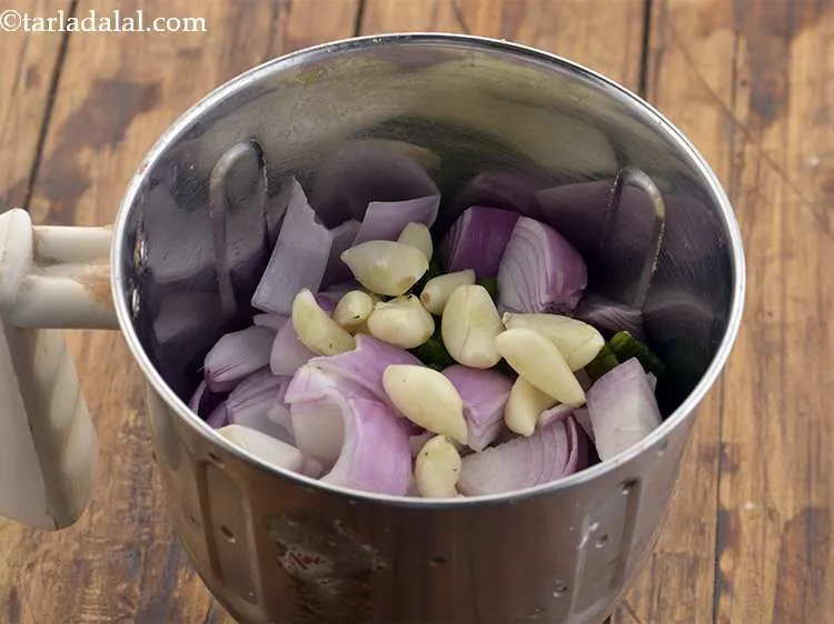 Step 19 – Add the garlic (lehsun) cloves for their piquancy.