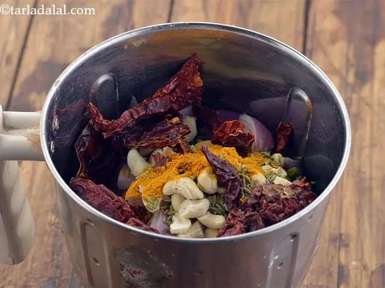 Step 23 – Now add the broken dry kashmiri red chillies .