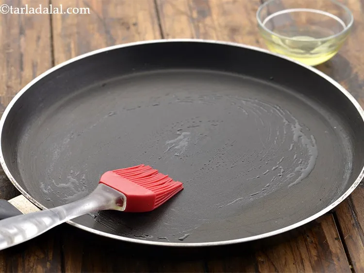 Step 23 – Heat a non-stick tava (griddle) and grease it well using 1 tsp of oil.