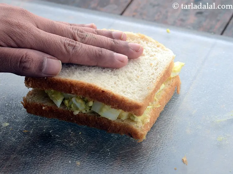 Step 11 – Press the boiled egg sandwich gently.