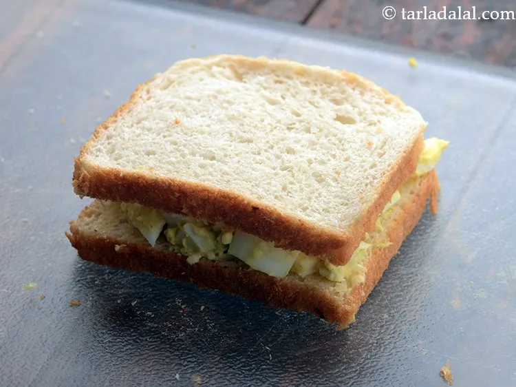 Step 10 – Cover it with another slice of bread, with the buttered side facing downwards. Add in …