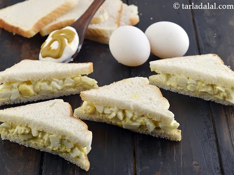 Step 14 – Serve <strong>egg sandwich</strong> immediately.&nbsp;<a href="https://www.tarladalal.com/Quick-Coleslaw-Sandwich-40209r" target="_blank">Quick Coleslaw Sandwich</a>, <a href="https://www.tarladalal.com/Cabbage-and-Carrot-Double-Decker-Sandwich-38988r" target="_blank">Cabbage and Carrot Double Decker …
