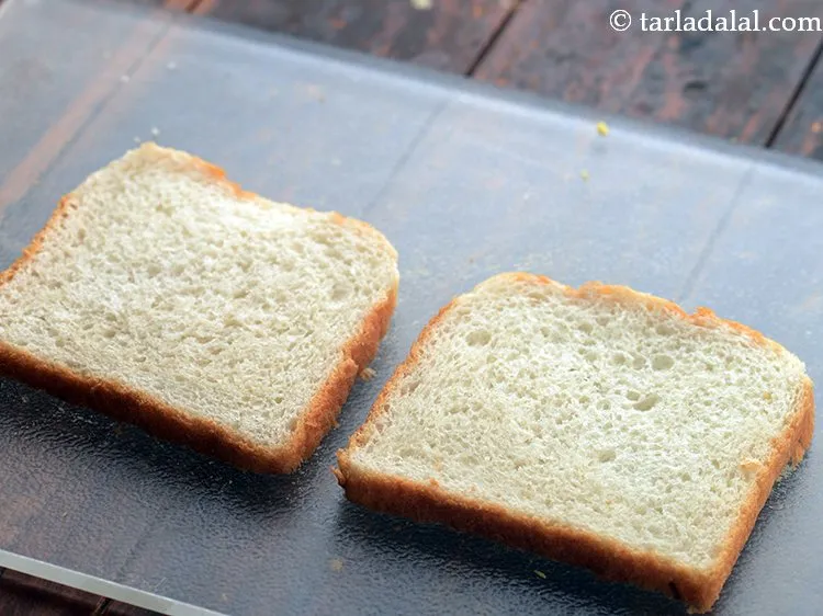 Step 7 – To assemble the boiled egg sandwich, place two bread slices on a clean dry surface.