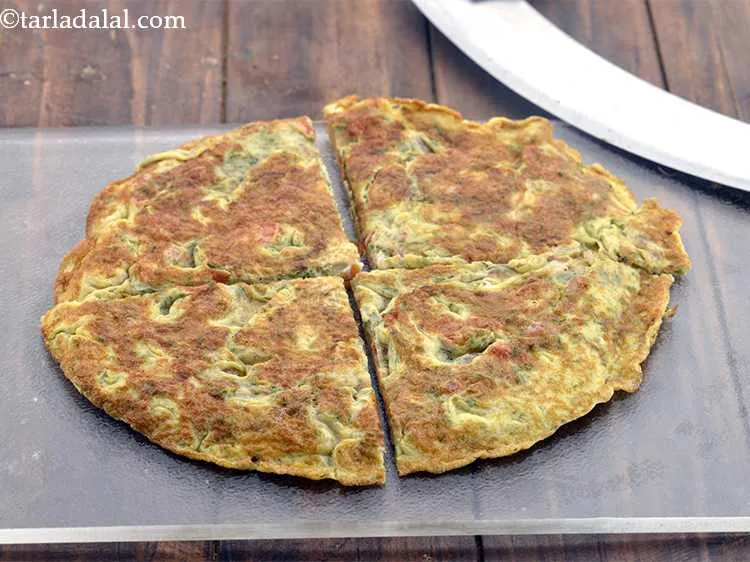 Step 28 – Cut the <strong>Egg Paratha </strong>into 4 equal portions using a cutter or a sharp knife.