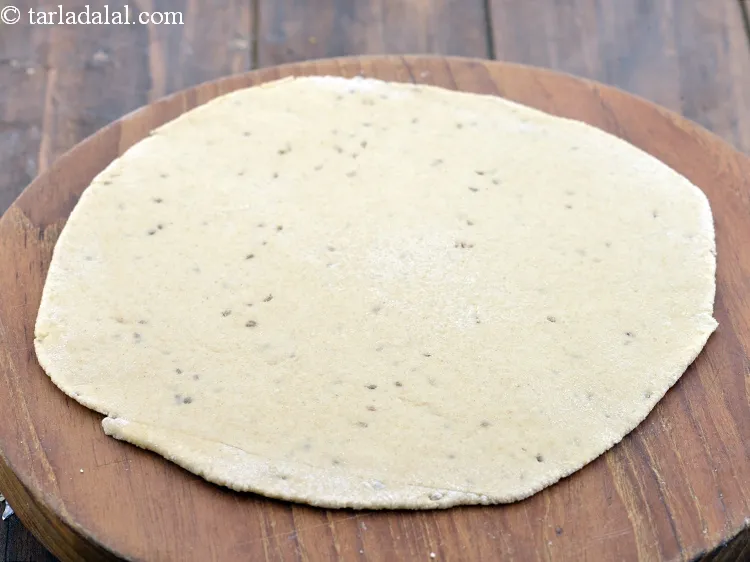 Step 9 – Roll a portion of the dough into 150 mm. (6&rdquo;) diameter circle using a rolling …