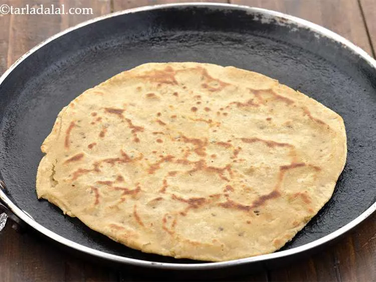 Step 15 – Cook the paratha using &frac12; tsp of oil. It should become golden brown in colour …