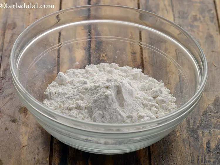 Step 8 – For the rotis, add 3/4 cup&nbsp;<a href="https://www.tarladalal.com/glossary-plain-flour-maida-188i">plain flour (maida)</a> in a deep bowl.&nbsp;