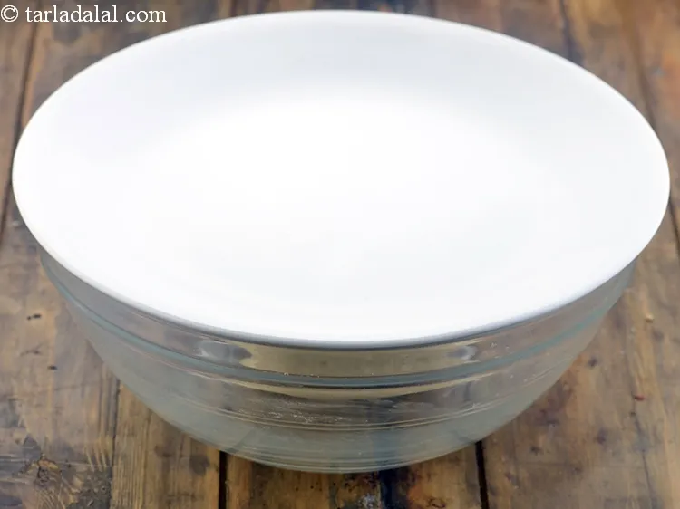 Step 14 – Cover the dough with a lid and keep aside for 15 minutes.