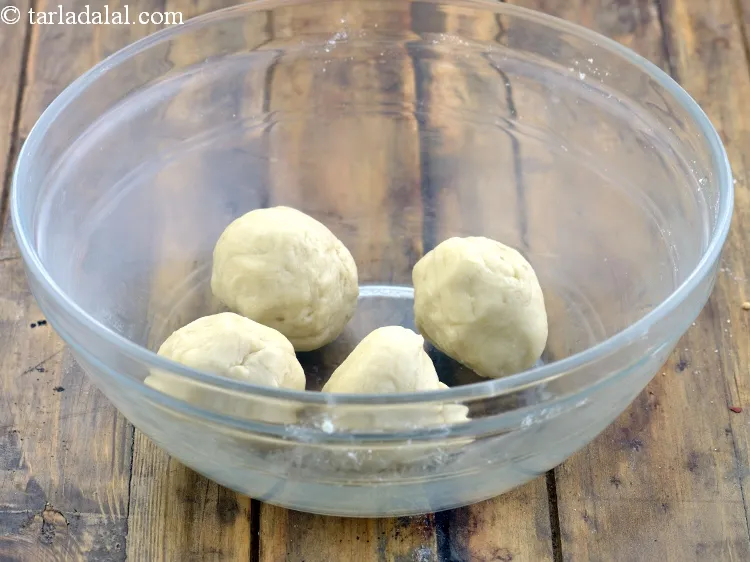 Step 15 – Divide the dough into 4 equal portions.