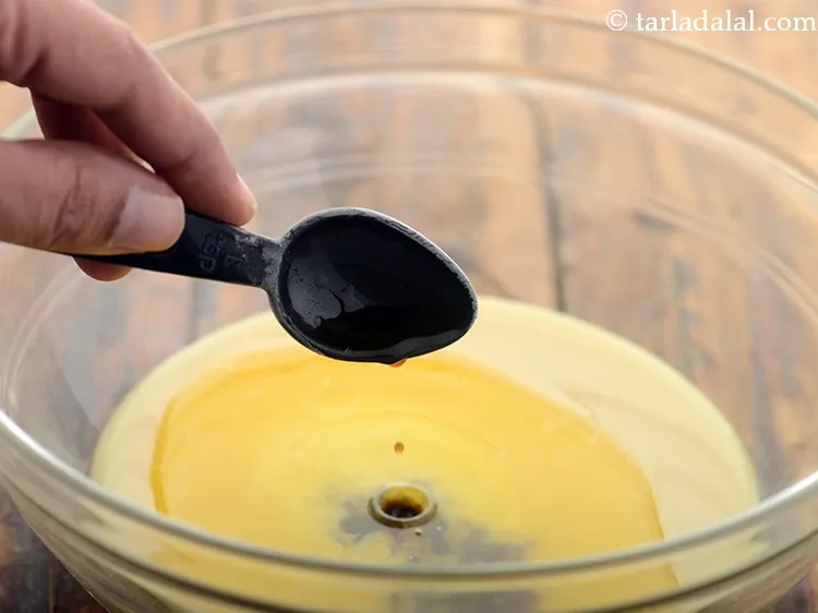 Step 35 – Add 1 tsp&nbsp;<a href="https://www.tarladalal.com/glossary-vanilla-essence-406i">vanilla essence</a>.