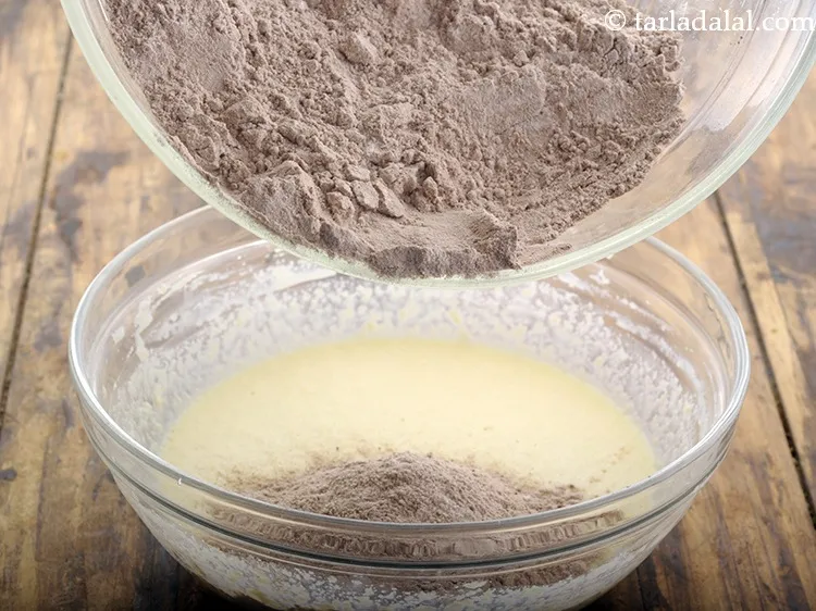 Step 37 – Add the prepared sieved plain flour-cocoa mixture.