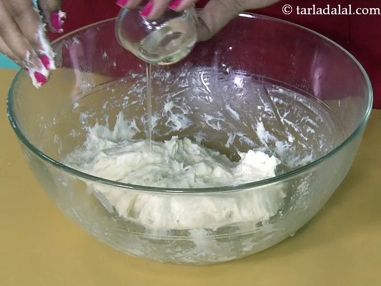 Step 18 – At this stage, add the oil and knead again till the dough is smooth, non …