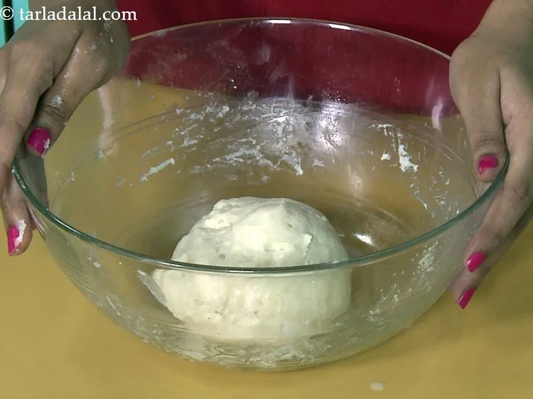 Step 19 – Divide the dough of <strong>eggless chocolate doughnut</strong> into 2 equal portions.
