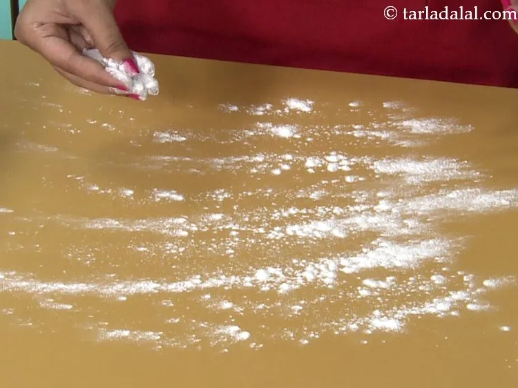 Step 20 – Sprinkle some plain flour on a flat, dry surface. This will make rolling easier.