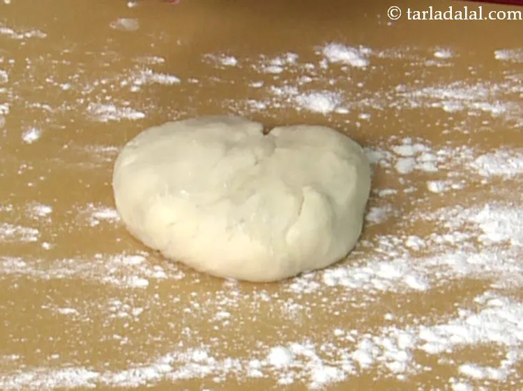 Step 21 – Place one dough portion on this surface.&nbsp;
