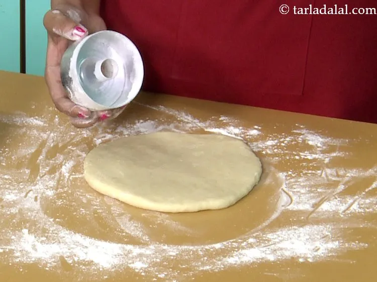 Step 23 – Take a 75 mm. (3&rdquo;) doughnut cutter and dust it with some plain flour. This …