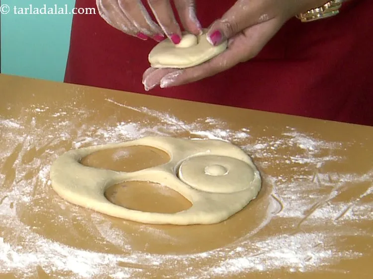 Step 25 – Discard the centre round portion of each of the 3 circles to form a ring …