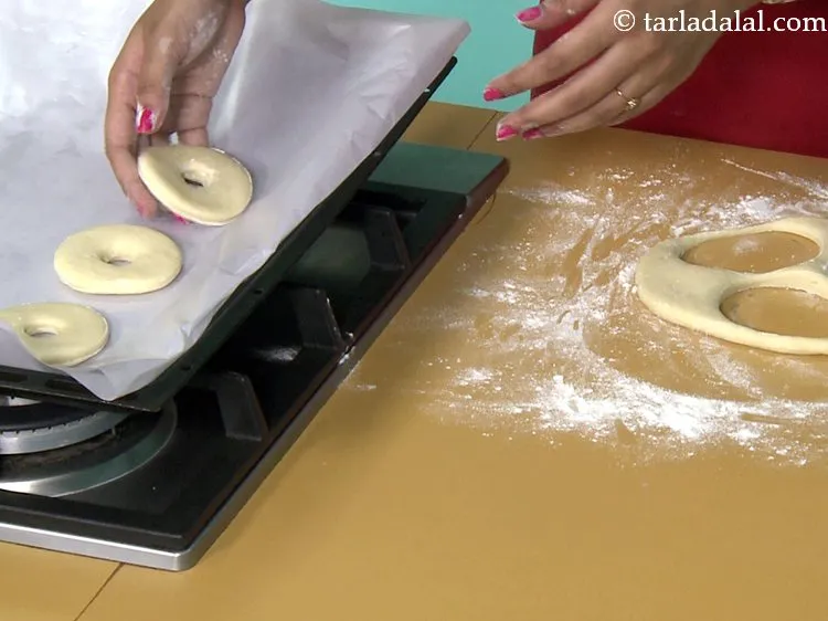 Step 26 – Place the <strong>chocolate doughnut</strong> on a butter paper.