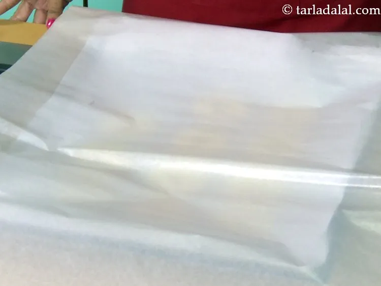 Step 28 – Cover the <strong>doughnuts </strong>with another butter paper while avoiding any contact with them. There should …