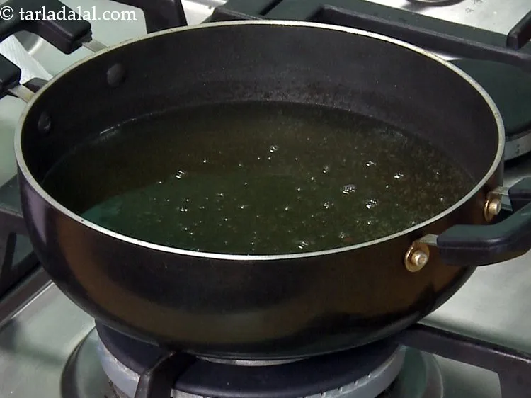 Step 29 – Heat the oil in a non-stick kadhai. The oil should be not be very hot. …