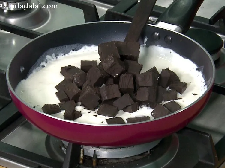 Step 35 – Switch off the flame and add the dark chocolate. Here we have cut them into …
