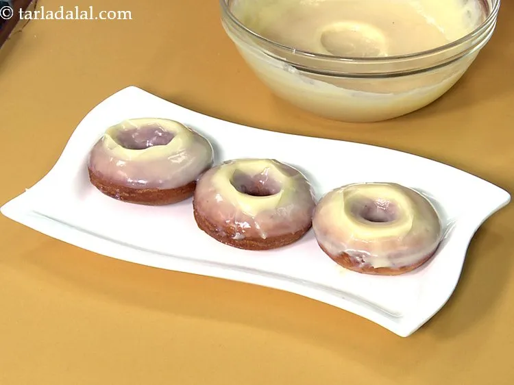 Step 47 – You can also dip one half of a doughnut in the dark chocolate and place …