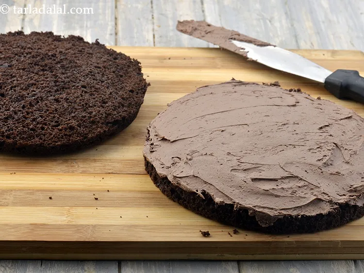 Step 63 – Spread 1 portion of the whipped cream mixture evenly on the bottom layer of the …