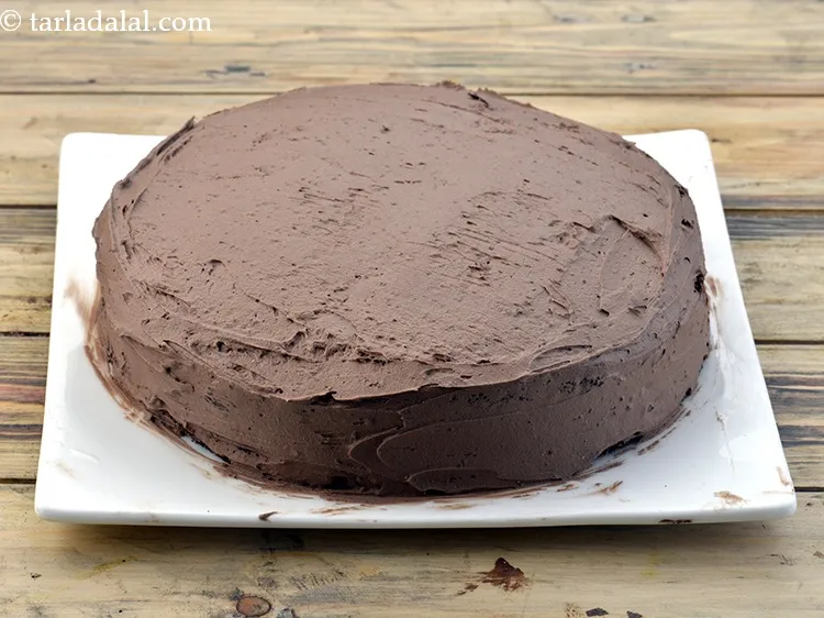 Step 65 – Spread the remaining whipped cream mixture evenly on top and at the sides of the …