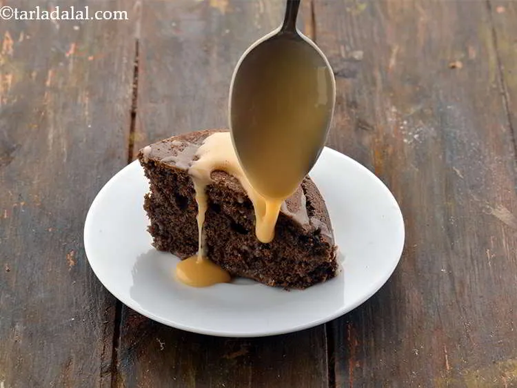 Step 9 – <strong>Orange Glaze icing</strong> with Eggless Chocolate Sponge Cake using condensed. Cut a wedge from the<strong>&nbsp;<a …