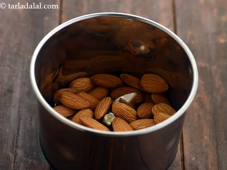 Step 6 – Put the almonds in a small mixer jar. We are making a super healthy cake …