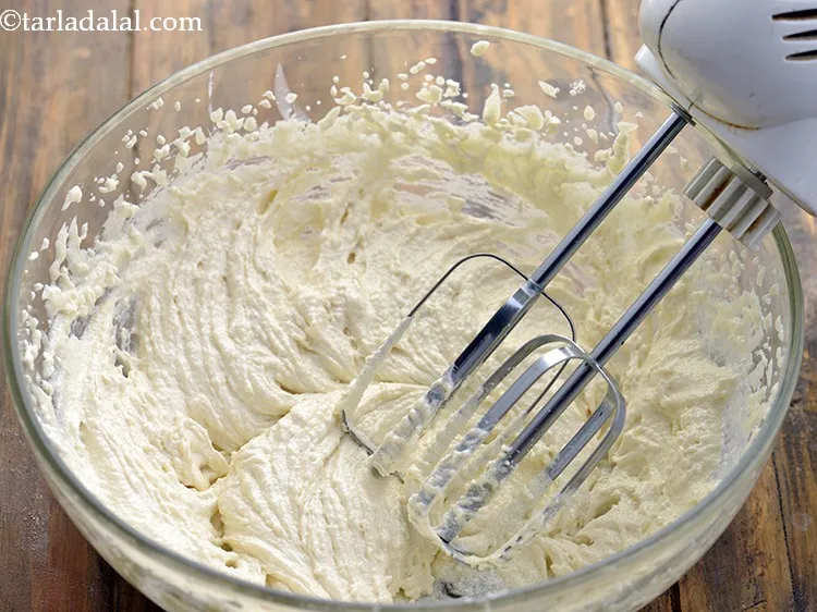 Step 13 – Add the sugar, condensed milk and vanilla essence beat it till smooth..