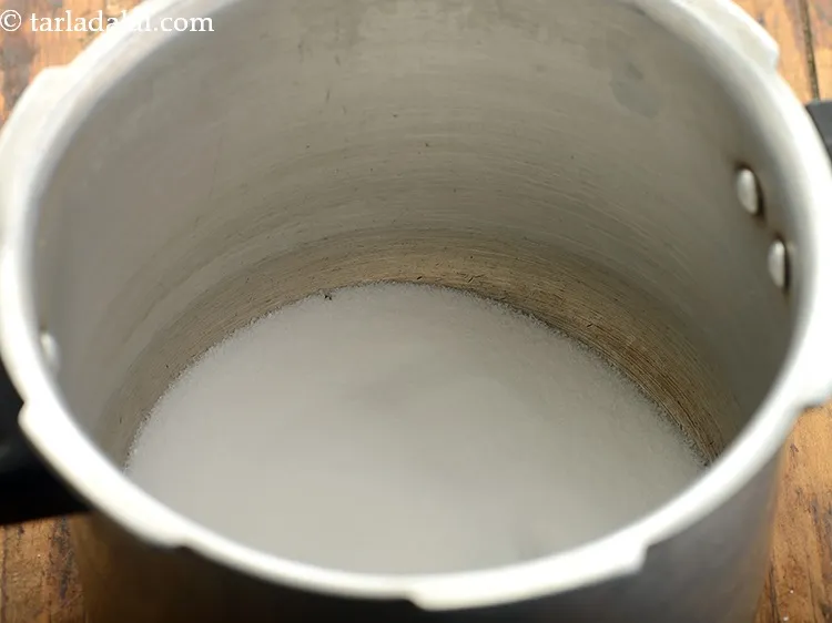 Step 42 – <strong>To prepare the pressure cooker for eggless chocolate cake in pressure cooker recipe | eggless …