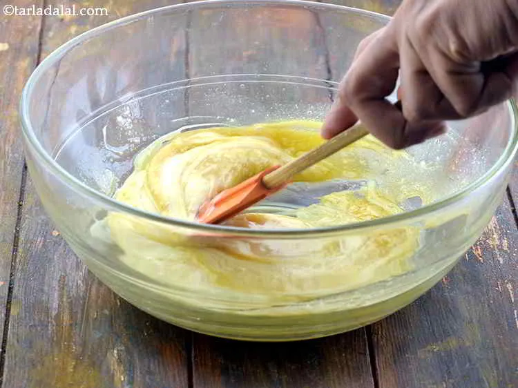 Step 14 – Now, add the sieved flour mixture into the bowl. You can add it part by …