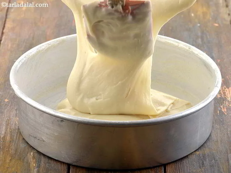 Step 17 – Pour the batter into the greased and dusted tin.