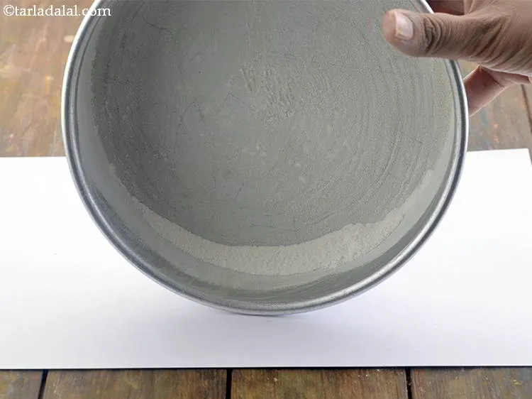 Step 3 – Dust the tin with plain flour. This will prevent the butter from melting into the …