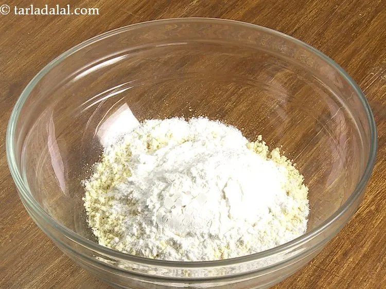 Step 3 – Add rice flour to get a crispy outer covering for the eggplant pakoda.