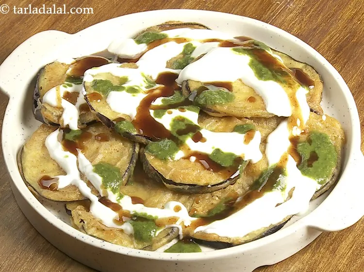 Step 22 – Drizzle 2 tsp of sweet chutney. Also, the <a href="https://www.tarladalal.com/Sweet-Chutney-(--Desi-Khana-)-2360r" target="_blank">meethi chutney</a>&nbsp;can be made prior …