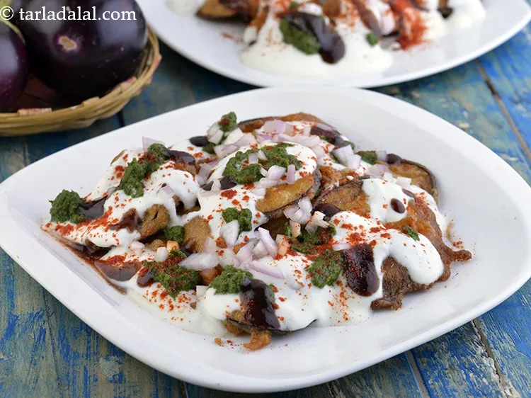 Step 26 – <a href="https://www.tarladalal.com/Spinach-Pakoda-Chaat-(--Desi-Khana)-1511r" target="_blank">Spinach Pakoda Chaat</a>, <a href="https://www.tarladalal.com/Crispy-Patra-Chaat-Patra-Chaat-with-Curds-and-Chutneys-42048r" target="_blank">Crispy Patra Chaat</a>, <a href="https://www.tarladalal.com/Ram-Ladoo-Delhi-Street-Food-Chaat-42060r" target="_blank">Ram Ladoo</a> are …