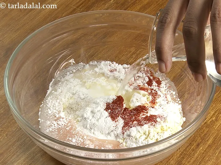 Step 7 – Gradually add water &frac34; cup of water and prepare a lump-free batter using a whisk. …