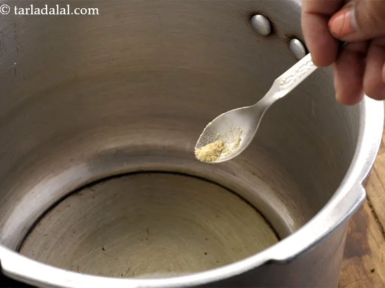 Step 26 – When the ghee melts, add asafoetida. You can even temper the dal bhat with cumin …