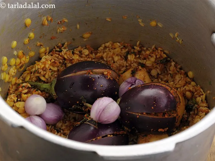 Step 33 – Add the stuffed vegetables and onions.