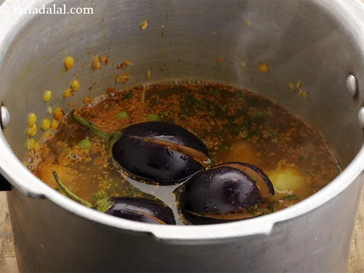 Step 35 – Add salt and 2&frac12; cups of hot water. Hot water fastens the cooking process.