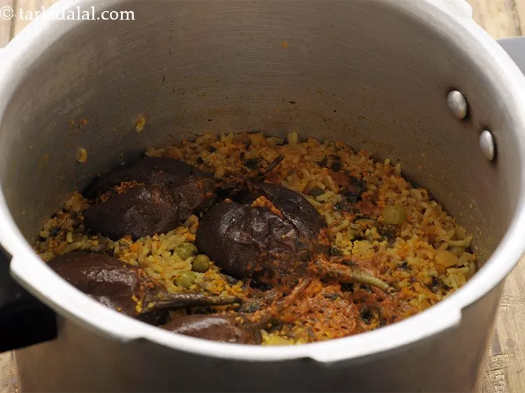 Step 37 – Pressure cook on a high flame for 3 whistles. Allow the steam to escape using …